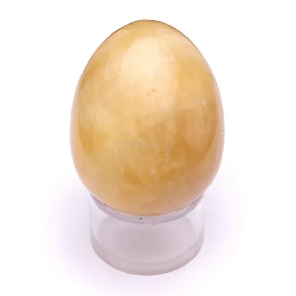 mineral de calcita amarilla pulido en forma de huevo
