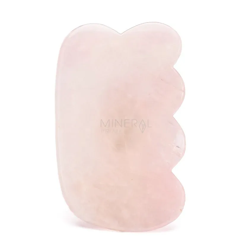 gua sha de cuarzo rosa con forma de peine